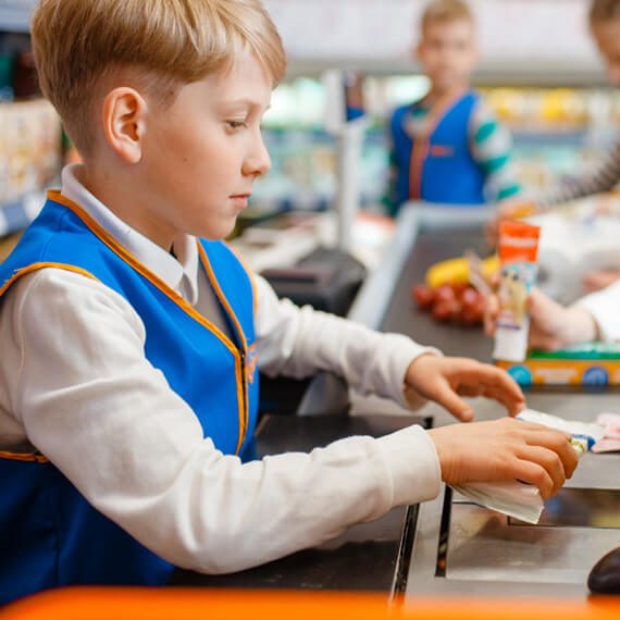 boy-in-uniform-at-the-register-playing-salesman-YXW57GU.jpg